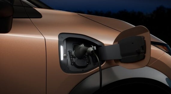 Close-up image of charging cable plugged in | Pischke Motors Nissan in La Crosse WI